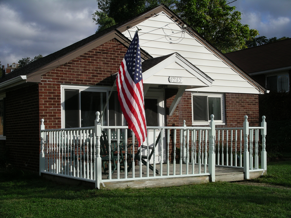 View of house from downhill part of sidewalk